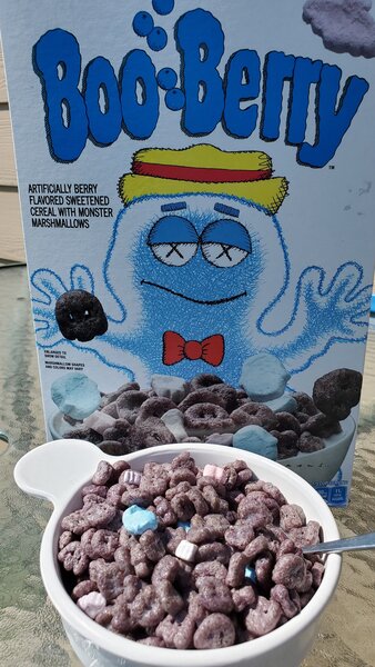 A bowl full of boo berry kaws packet