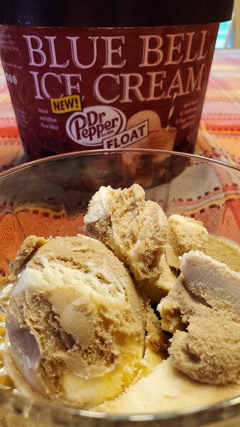 A Clear Glass Bowl With Three Scoops of Ice Cream