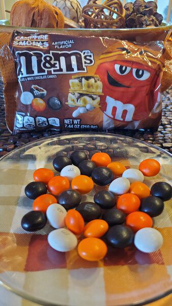 M & m's candy and pretzels on a plate.