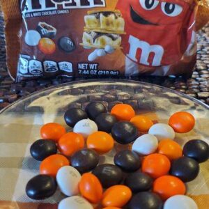 M & m's candy and pretzels on a plate.
